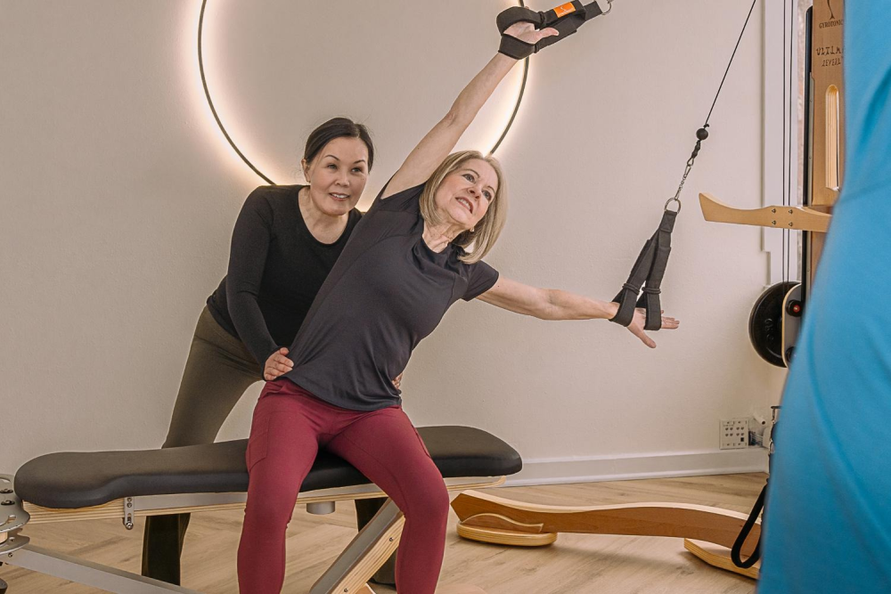 Woman doing assisted stretching exercise